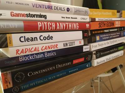 A pile of books about programming, management and business